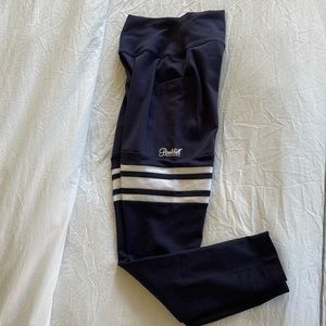 New with tags bombshell yoga pants size medium. Blue with white stripes. Cute!